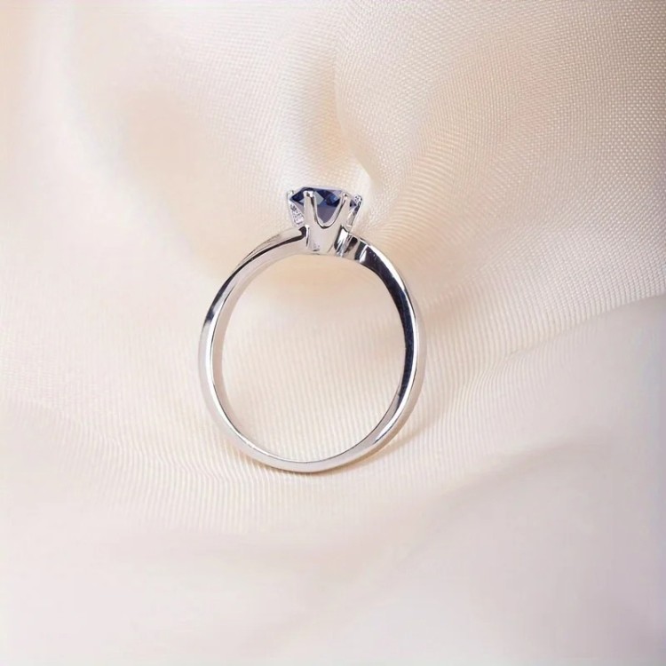 Anillo de compromiso en plata asimétrico con zafiro